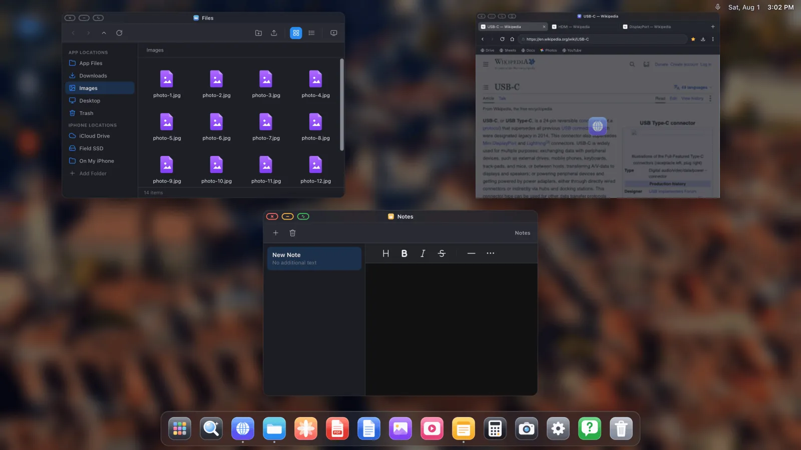 An overview of several open windows on an external display, files, notes and a browser.