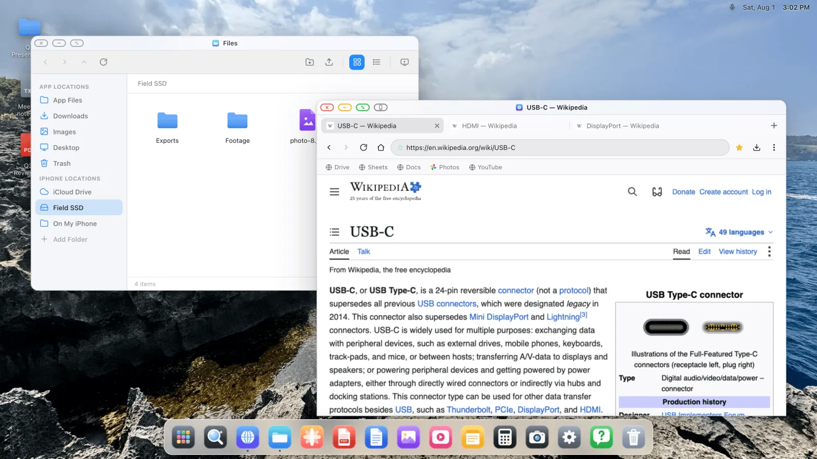 A light-themed desktop on an external screen with a file manager window and a browser window open side by side.